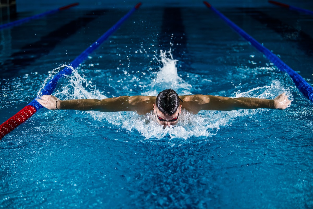 Swimmer mid butterfly stroke